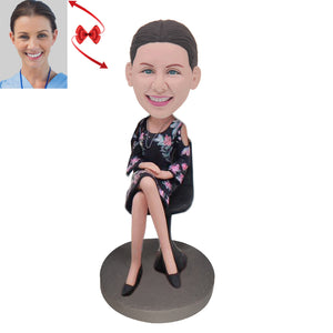 An Elegant Lady Sitting in A Chair Custom Bobblehead